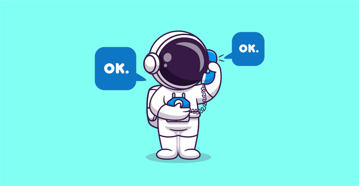 Astronaut som pratar i bakelit-telefon. Astronauten säger "OK." och får exakt samma svar i luren: "OK."
